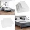 Collage of product images showing a mattress protector and a bed. Includes a lifestyle shot of a bed in a room, a product shot of multiple mattress protectors, and close-ups of the mattress protectors and a bed with bedding. Anteprima dell’immagine prodotto