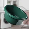 A green plastic basin is shown in a laundry room setting. Anteprima dell’immagine prodotto