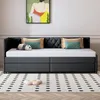 A daybed with pillows and a stuffed panda is shown in a room with a painting on the wall and a patterned rug on the floor. Produktbild-Vorschau