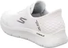 A white Skechers slip-on shoe is shown from the side and back. Voir les images du produit