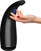 A hand is being presented to a black automatic soap dispenser to receive soap. Náhled obrázku produktu