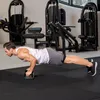 A man is doing push-ups in a gym. Produktbild-Vorschau