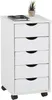 A white rolling storage cabinet with five drawers is shown against a white background. A small potted plant and a notebook with a pen are on top of the cabinet. Produktbild-Vorschau