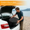 A man loading a black carrying bag into the trunk of a white car near a body of water. Produktbild-Vorschau