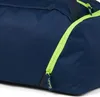 A close-up view of a navy blue duffel bag with a lime green zipper. Náhľad obrázku produktu