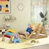 Two babies playing on a wooden Montessori climbing structure in a brightly lit room. Produktbild-Vorschau