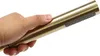 A hand holding a gold-colored shower head. Podgląd zdjęcia produktu