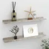 Two grey concrete effect shelves mounted on a white wall, decorated with various home decor items. Podgląd zdjęcia produktu