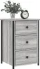 A gray wood-effect nightstand with three drawers and black metal accents, topped with a vase of greenery and a black alarm clock. Produktbild-Vorschau