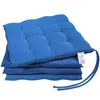 A stack of four blue seat cushions on a white background. Produktbild-Vorschau