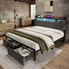 A bedroom scene featuring a bed with storage drawers and LED lighting. Voir les images du produit