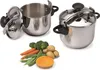 Two stainless steel pressure cookers and a pile of fresh vegetables on a white background. Produktbild-Vorschau