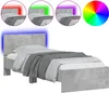 A single bed frame with a concrete gray finish and blue LED lighting around the headboard. Voir les images du produit