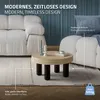 A living room scene with a modern sofa and coffee table. Náhled obrázku produktu