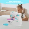 A young girl is using a toy sewing machine in a bright, indoor setting. Produktbild-Vorschau