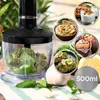 A collage of an immersion blender attachment and various food items, including hummus, avocado toast, muffins, and yogurt with granola, set against a kitchen-like background with fresh herbs and garlic. Produktbild-Vorschau