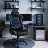 A gaming chair with RGB lighting is set up in a modern gaming room with a desk, computer, and shelves. Anteprima dell’immagine prodotto