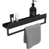 A black bathroom shelf with a towel rack, holding two small tubes and a large pump bottle, with a gray towel hanging from the rack. Anteprima dell’immagine prodotto
