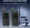 Two walkie-talkies are shown in the foreground with a blurred background of scales of justice and a gavel. Voir les images du produit