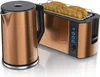 A copper kettle and a copper toaster with toast inside are displayed side-by-side on a white surface. Náhled obrázku produktu