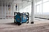 Construction site with workers and a radio. Produktbild-Vorschau