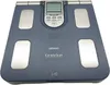A blue Omron KaradaScan body composition monitor is shown from a slightly elevated, front-facing angle against a light gray background. Podgląd zdjęcia produktu