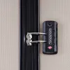 A close-up view of a luggage zipper and a TSA lock. Anteprima dell’immagine prodotto