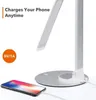 A desk lamp is shown charging a smartphone. Anteprima dell’immagine prodotto