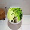 A toilet seat with a decorative image of bamboo leaves and stacked stones. Produktbild-Vorschau