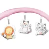 A close-up of a baby play gym arch with three hanging plush toys: a lion, a cat, and a raccoon. Anteprima dell’immagine prodotto