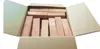 A cardboard box filled with wooden blocks. Voir les images du produit