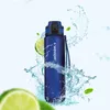 A blue water bottle is shown surrounded by water splashes and lime slices. Podgląd zdjęcia produktu