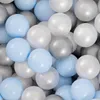 A close-up view of many colorful balls in a ball pit. Produktbild-Vorschau