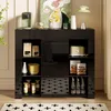 A modern black sideboard with various items displayed on top and inside its shelves, set in a well-lit room. Náhled obrázku produktu