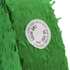 A close-up of a green piñata with a circular sticker indicating where to cut to fill it. Produktbild-Vorschau