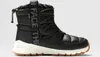 A black winter boot with white accents and a brown sole, shown against a white background. Podgląd zdjęcia produktu