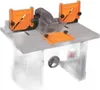 A woodworking router table with orange safety guards. Produktbild-Vorschau