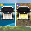 Two solar-powered wall lights are shown, one in daylight and one at night, demonstrating their functionality. Produktbild-Vorschau