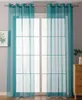 A room interior with a window covered by sheer turquoise curtains. Produktbild-Vorschau
