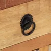 A close-up shot of a drawer pull on a wooden surface. Produktbild-Vorschau