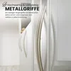 Close-up of cabinet handles on white cabinets. Produktbild-Vorschau