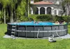 Two people relaxing in an above-ground swimming pool in a backyard setting. Produktbild-Vorschau