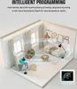 A 3D rendering of a living room with a thermostat in the foreground, illustrating intelligent programming and temperature control. Voir les images du produit