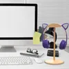 A desk setup with a computer monitor, keyboard, mouse, headphones on a stand, and a desk lamp. Náhľad obrázku produktu