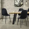 A dining room scene with a wooden table and black velvet chairs. Produktbild-Vorschau