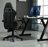 A gaming chair and desk setup in a room. Produktbild-Vorschau