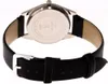 Close-up view of the back of a watch with a black leather strap. Produktbild-Vorschau