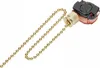 A close-up studio shot of a gold and black pull switch with a beaded chain. Podgląd zdjęcia produktu