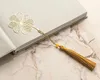 Signet à pompon en forme de trèfle à quatre feuilles doré + Voir les images du produit 3