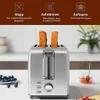 A stainless steel toaster with two slices of bread in it, placed on a kitchen counter with a bowl of blueberries and a jar of jam. Produktbild-Vorschau
